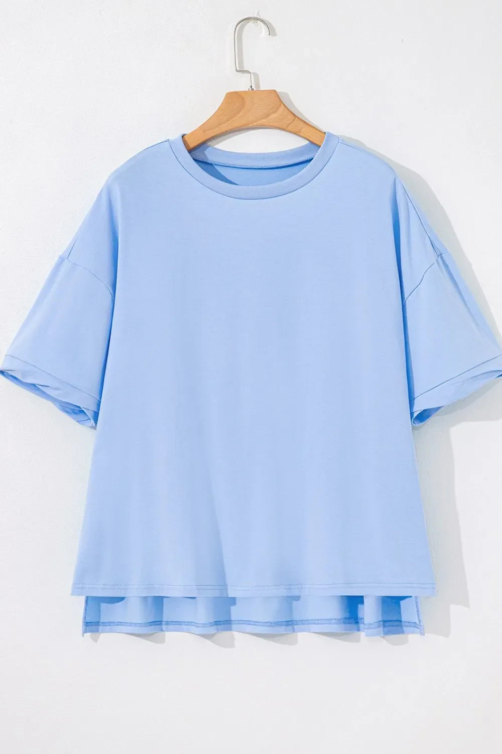 Camiseta holgada de media manga con dobladillo alto y bajo