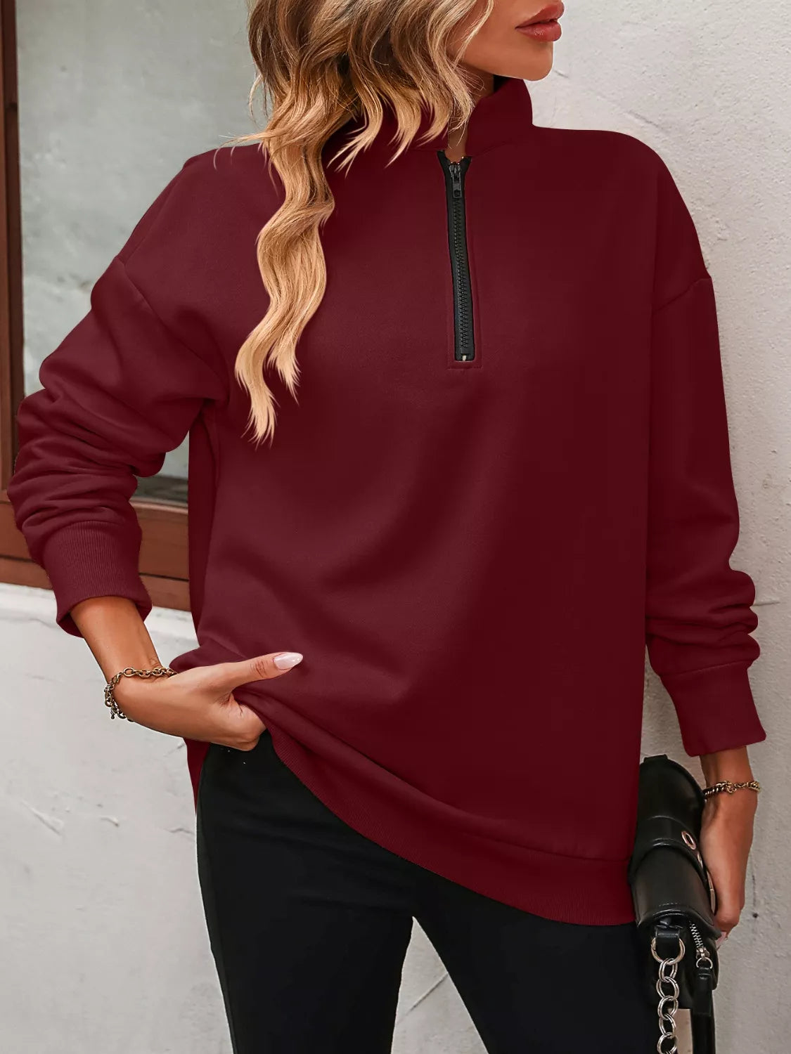 Sudadera con cremallera corta y hombros caídos
