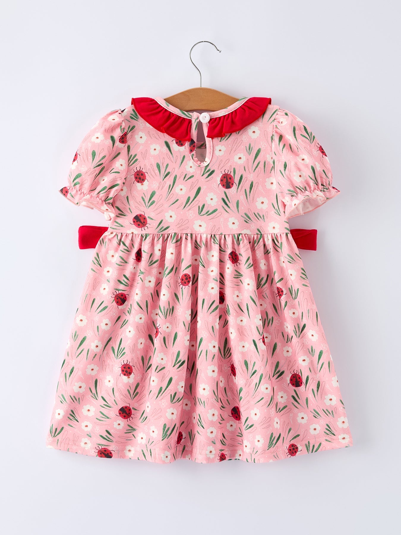 Vestido de niña con bordado fruncido de mariquita de primavera
