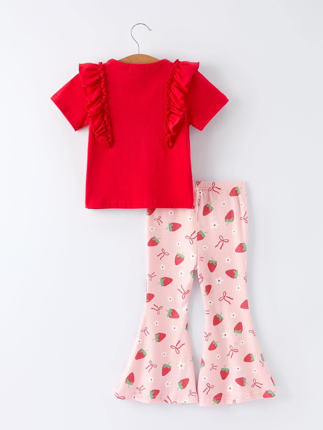 Conjunto de top con volantes y pantalones acampanados con lazo de fresa para niñas