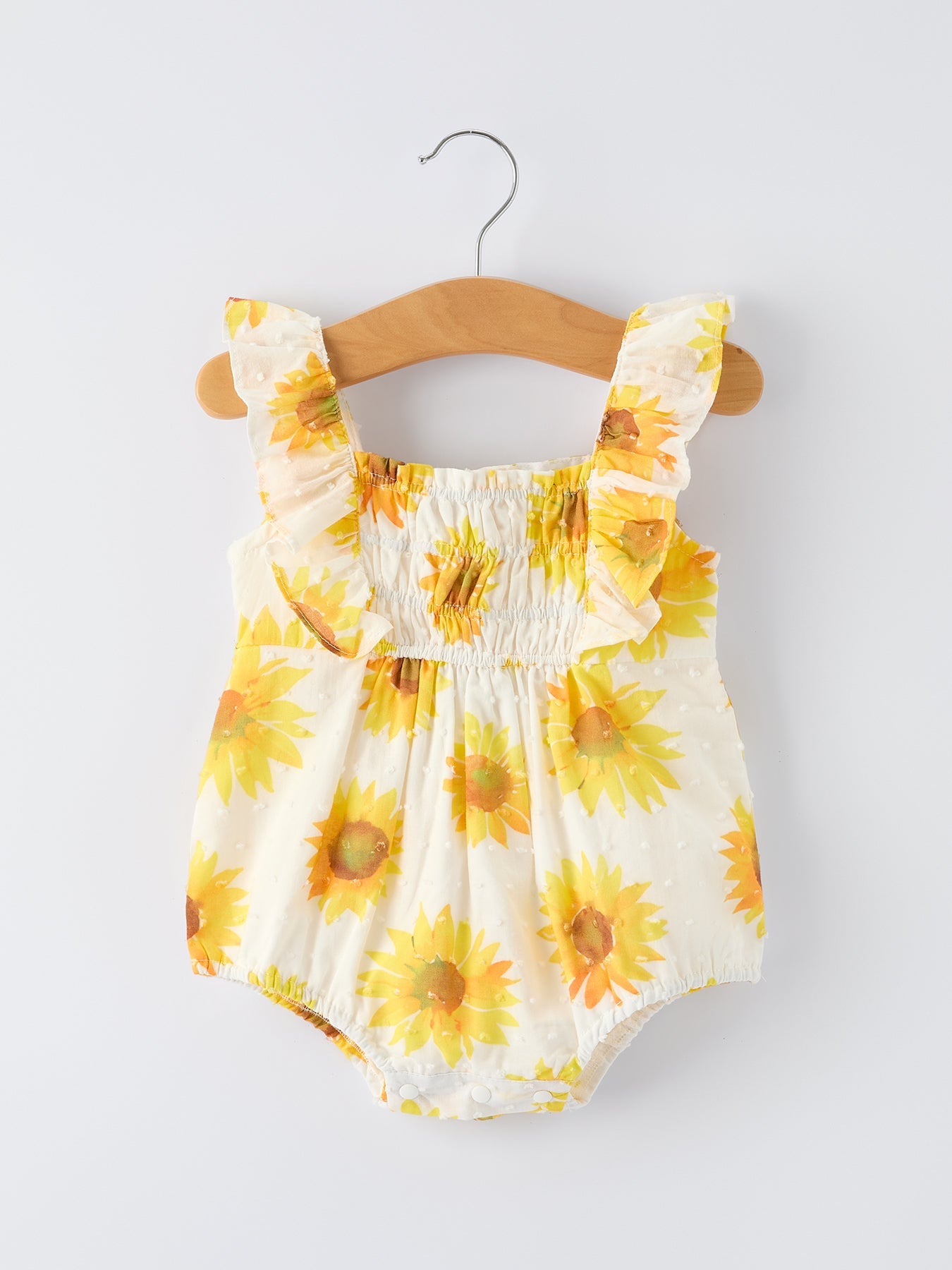 Mono con volantes fruncidos y estampado de girasoles para niñas