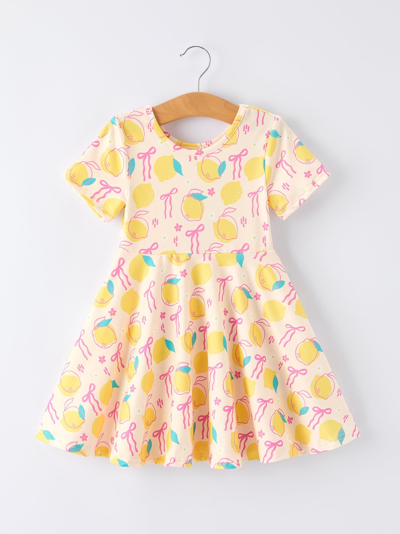 Vestido de verano con estampado de lazo y limones para niña