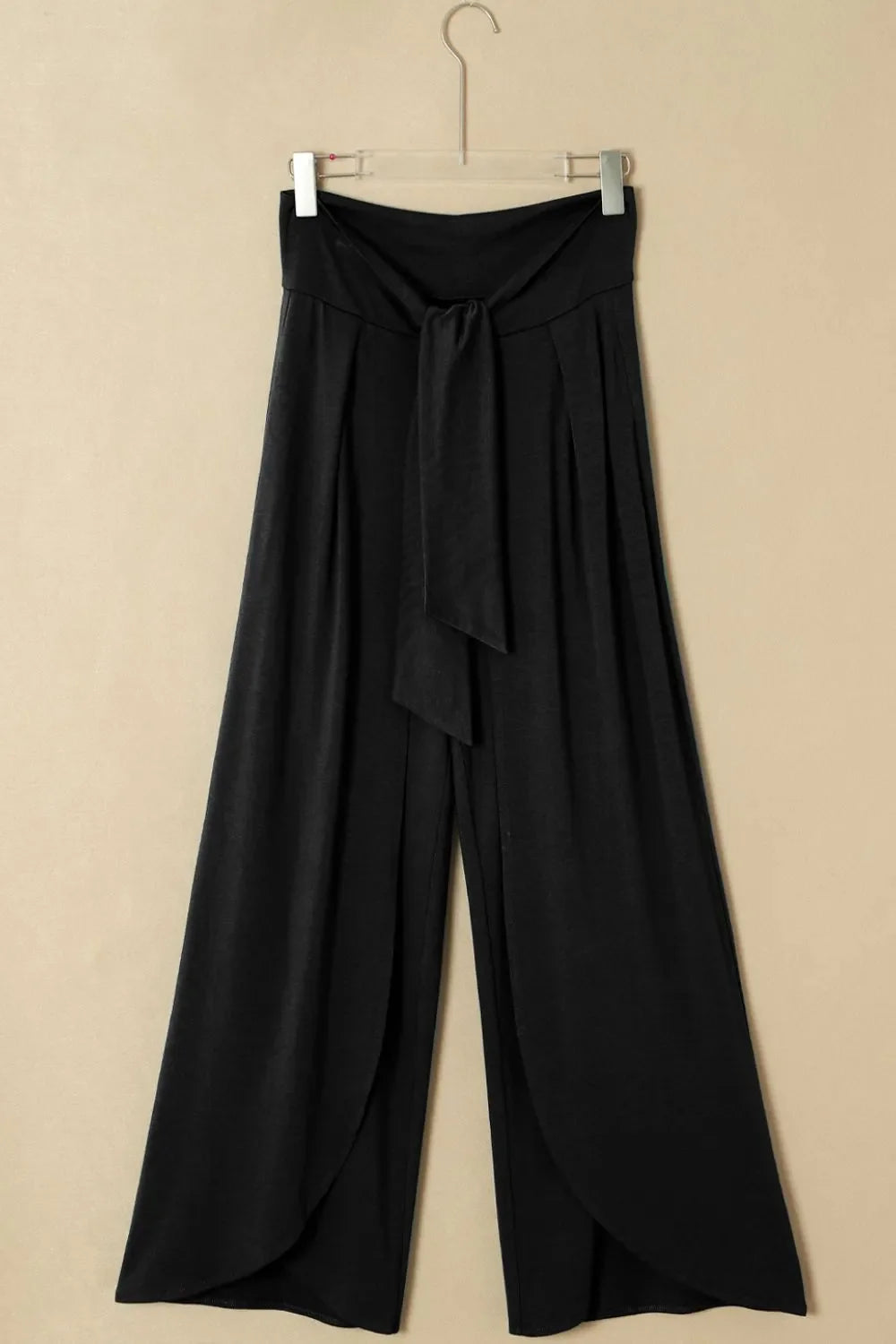 Pantalones holgados con cintura anudada y pierna dividida