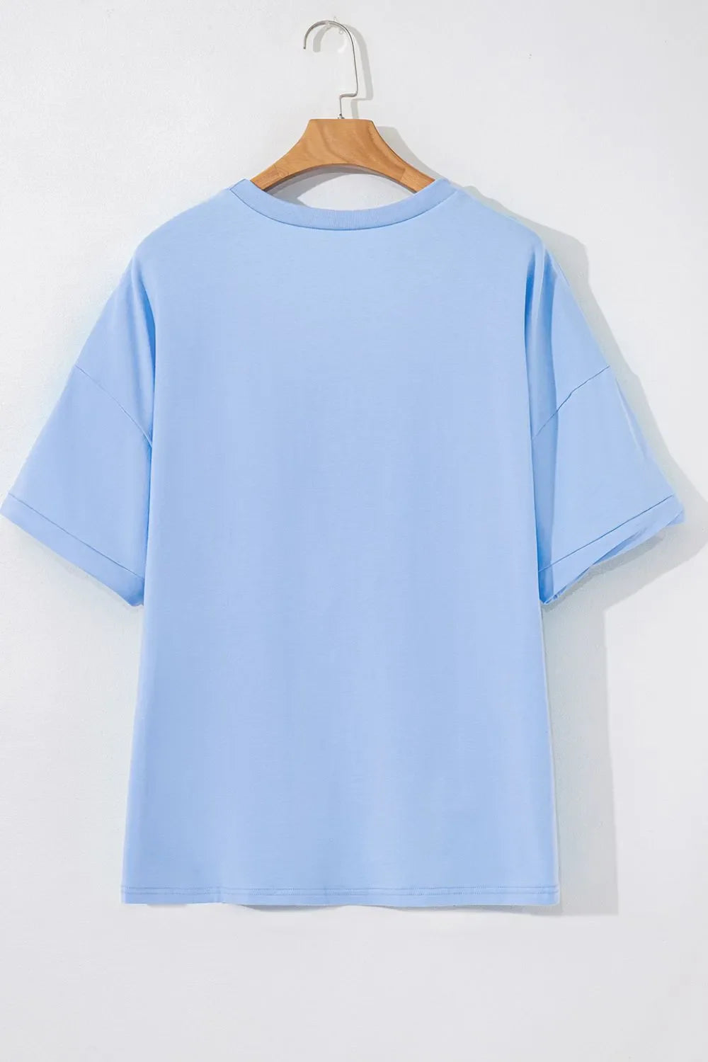 Camiseta holgada de media manga con dobladillo alto y bajo