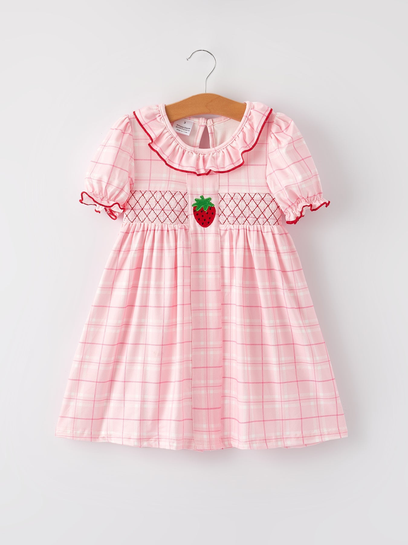 Vestido a cuadros rosa para niñas con aplicación de fresa