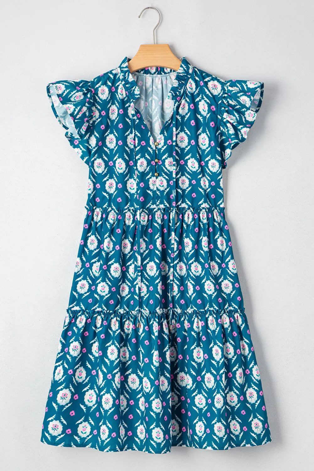 Vestido estampado con cuello anudado y volantes en las mangas
