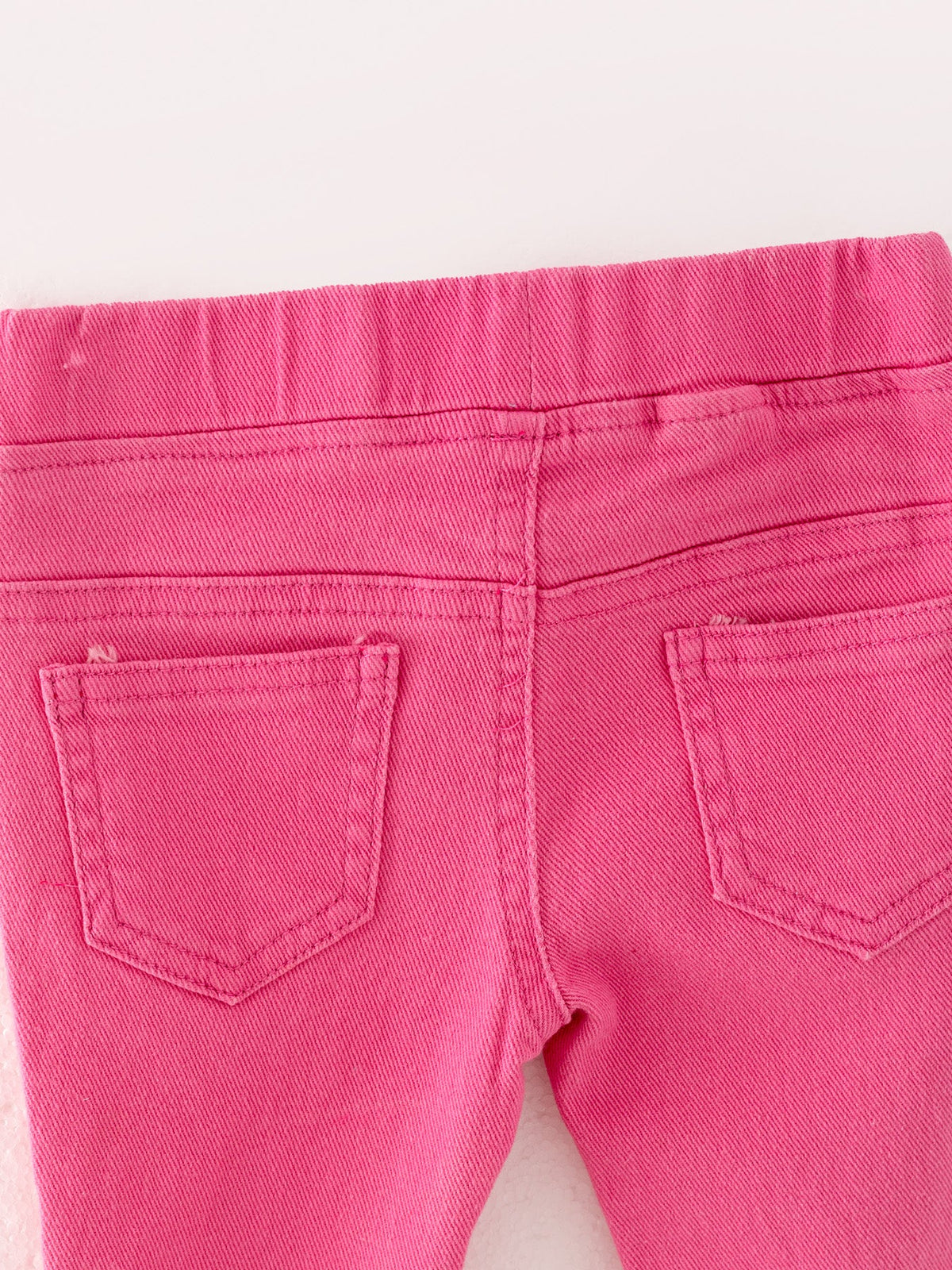 Pantalones acampanados de mezclilla con degradado rosa