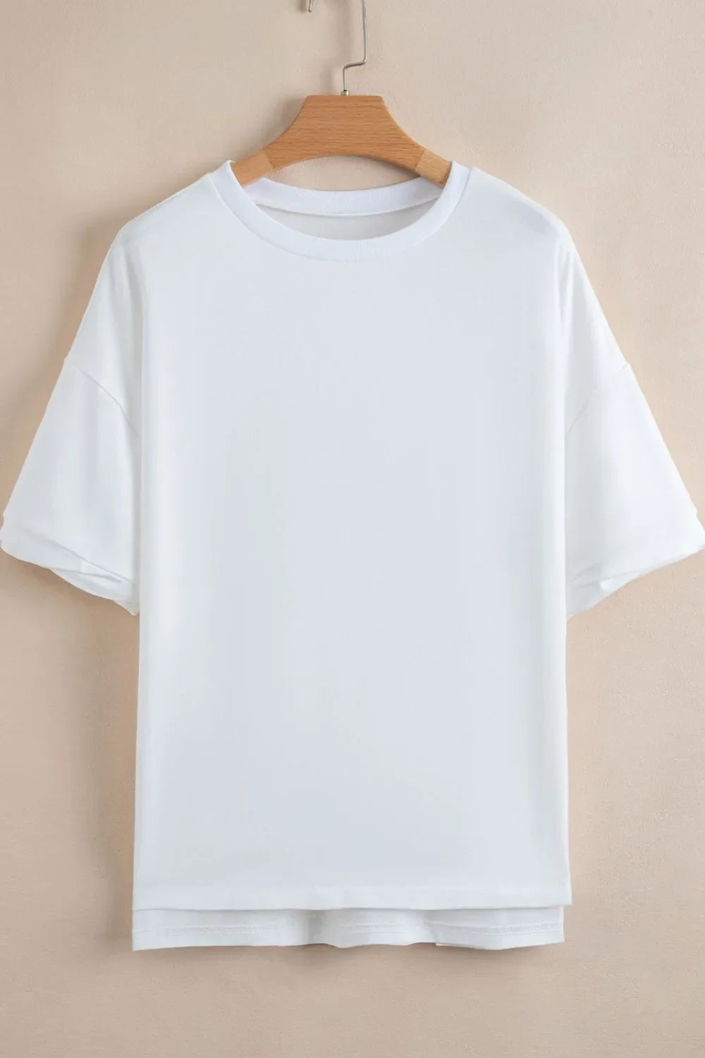 Camiseta holgada de media manga con dobladillo alto y bajo