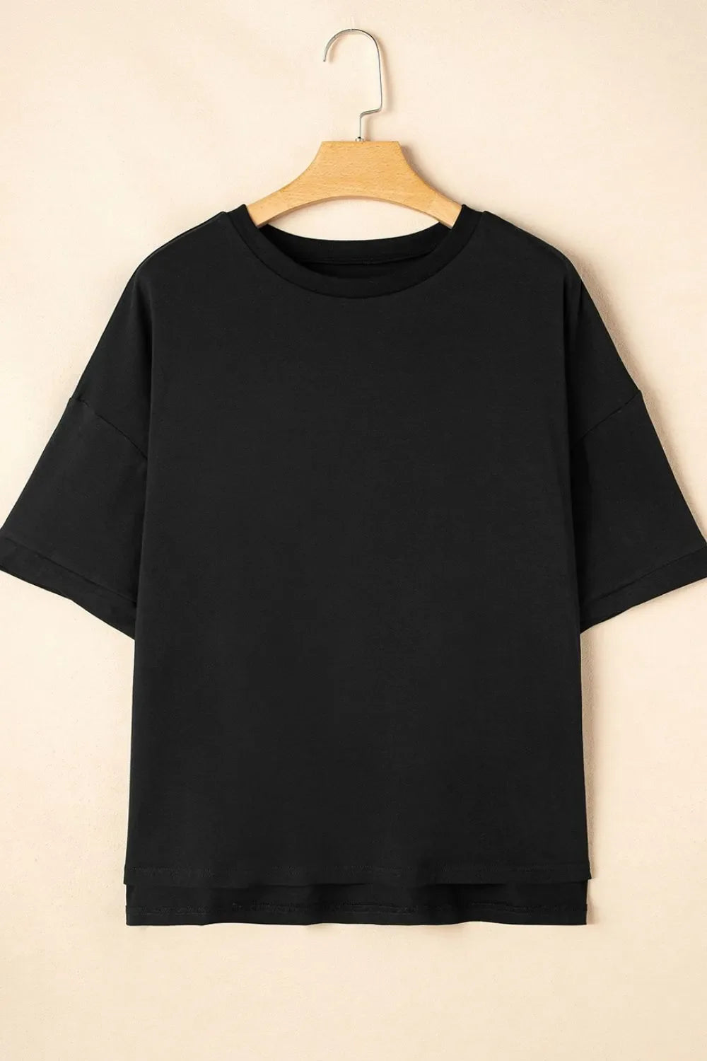 Camiseta holgada de media manga con dobladillo alto y bajo