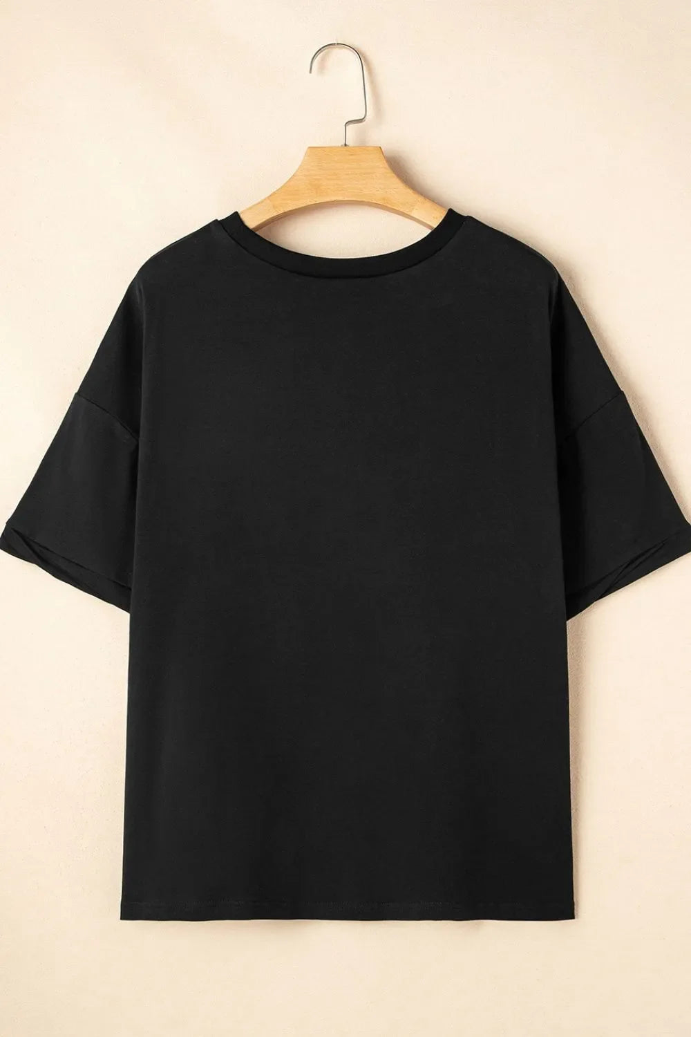 Camiseta holgada de media manga con dobladillo alto y bajo