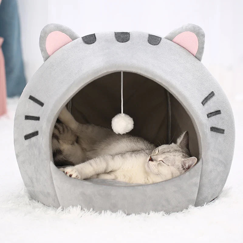 Bonita cama para gatos con forma de gato