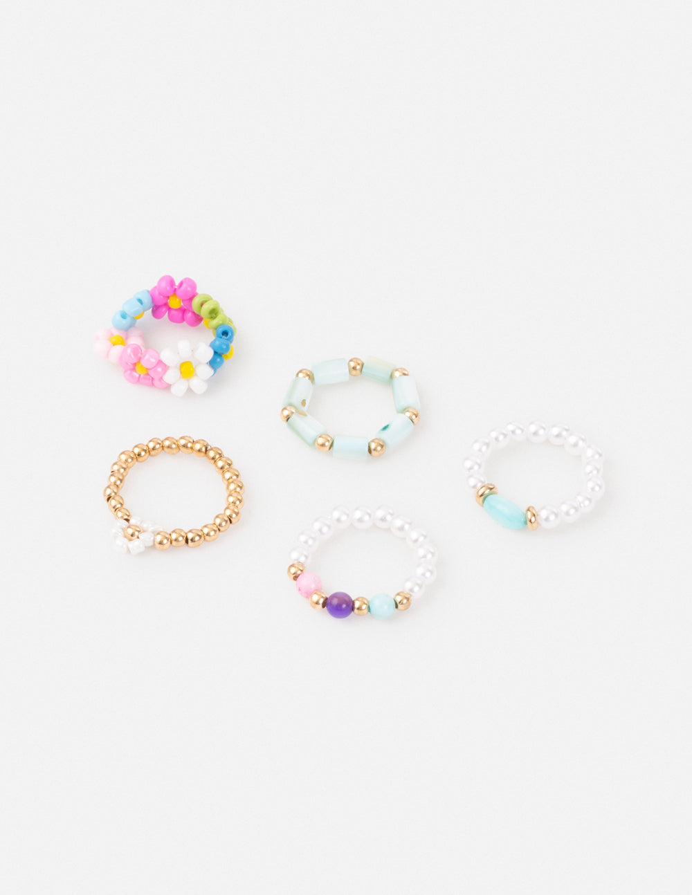Juego de anillos con cuentas en tonos pastel