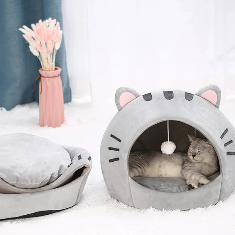 Bonita cama para gatos con forma de gato