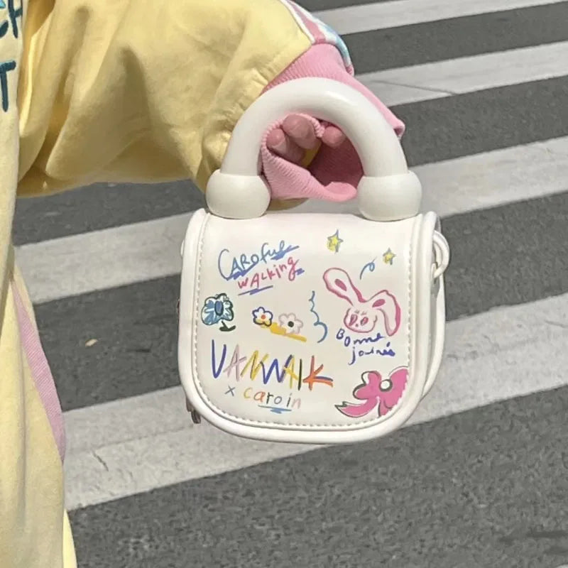 Bonita bolsa de mano con grafiti