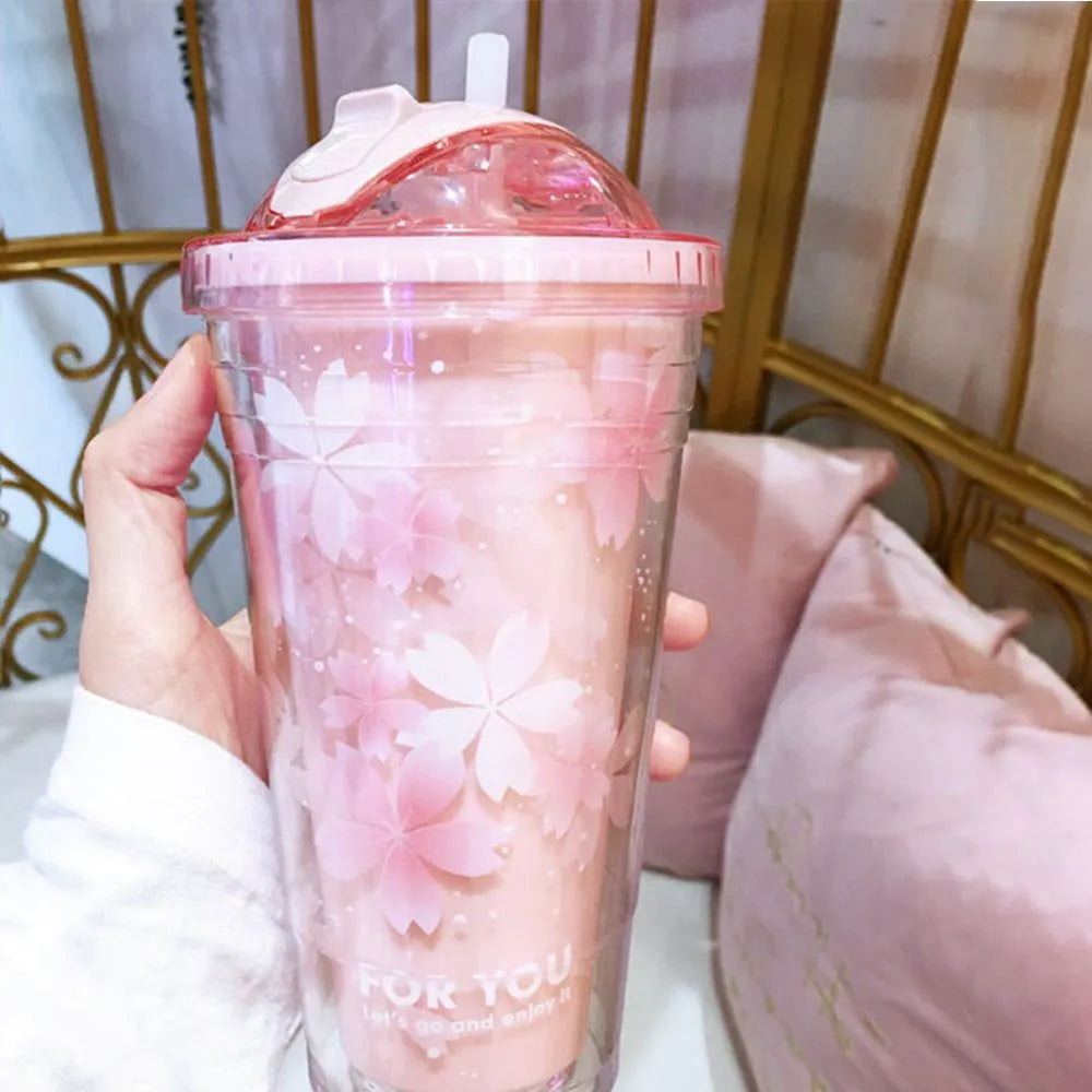 Botella de agua de plástico con diseño de flor de cerezo