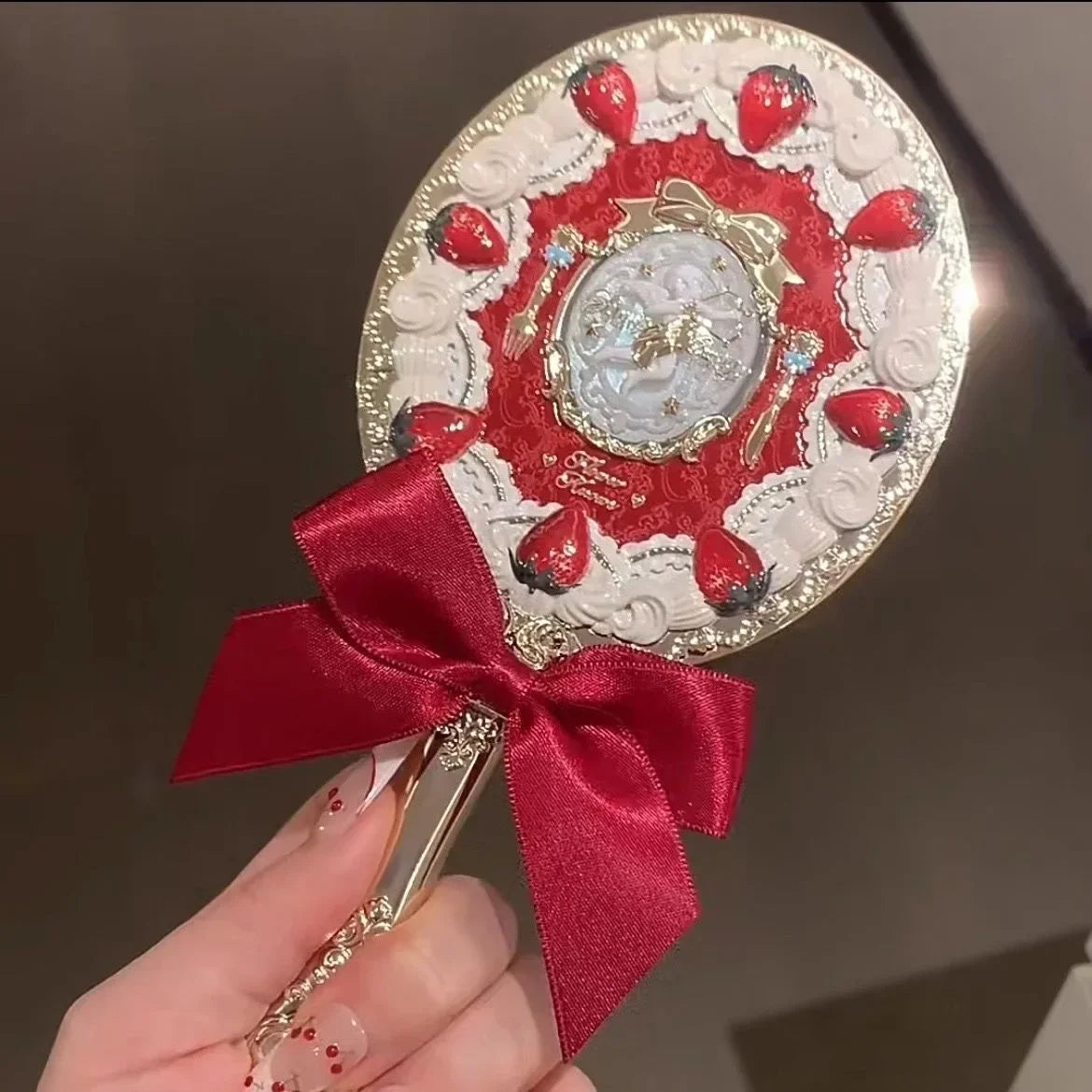 Espejo de mano de Cupido de fresa