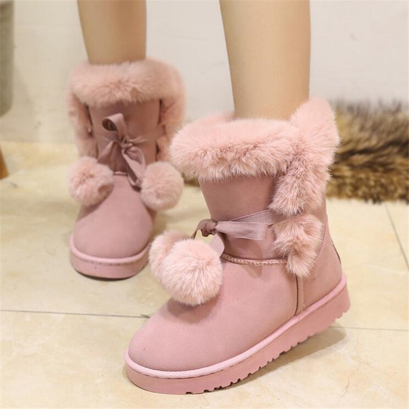 Botas de invierno peludas de color rosa