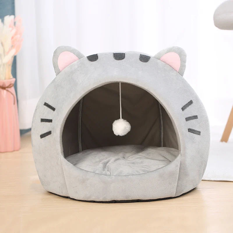 Bonita cama para gatos con forma de gato