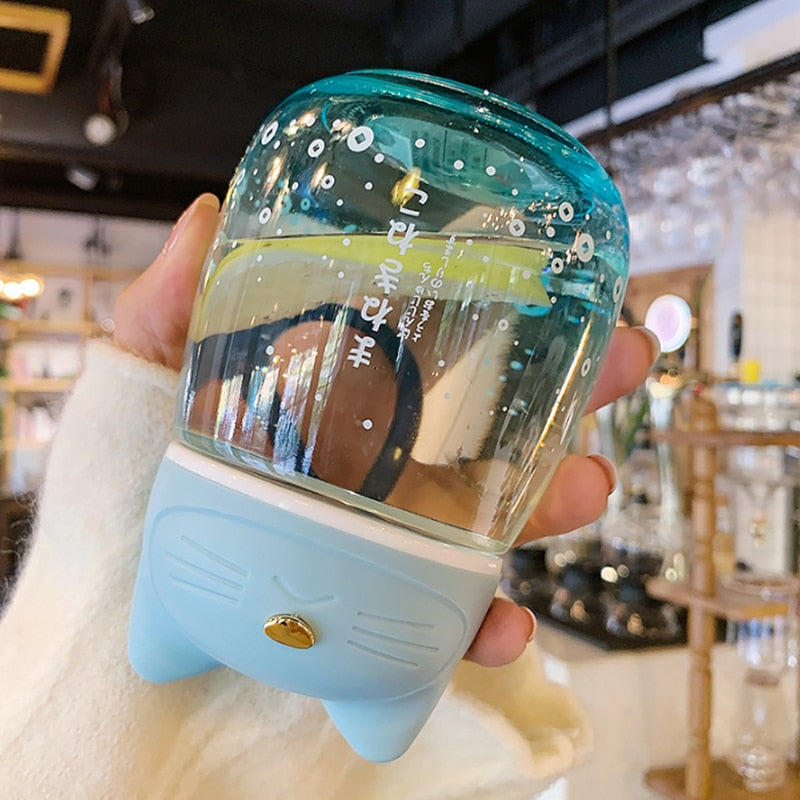 Botella de cristal con forma de gato