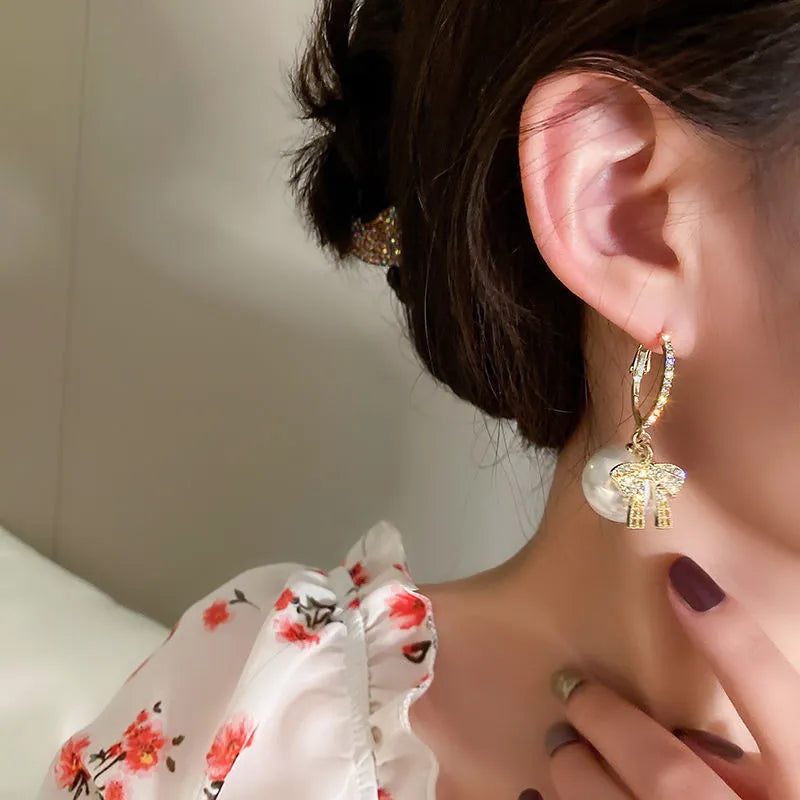Pendientes con adornos navideños
