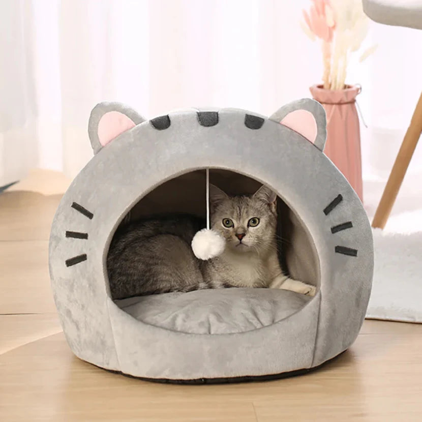 Bonita cama para gatos con forma de gato
