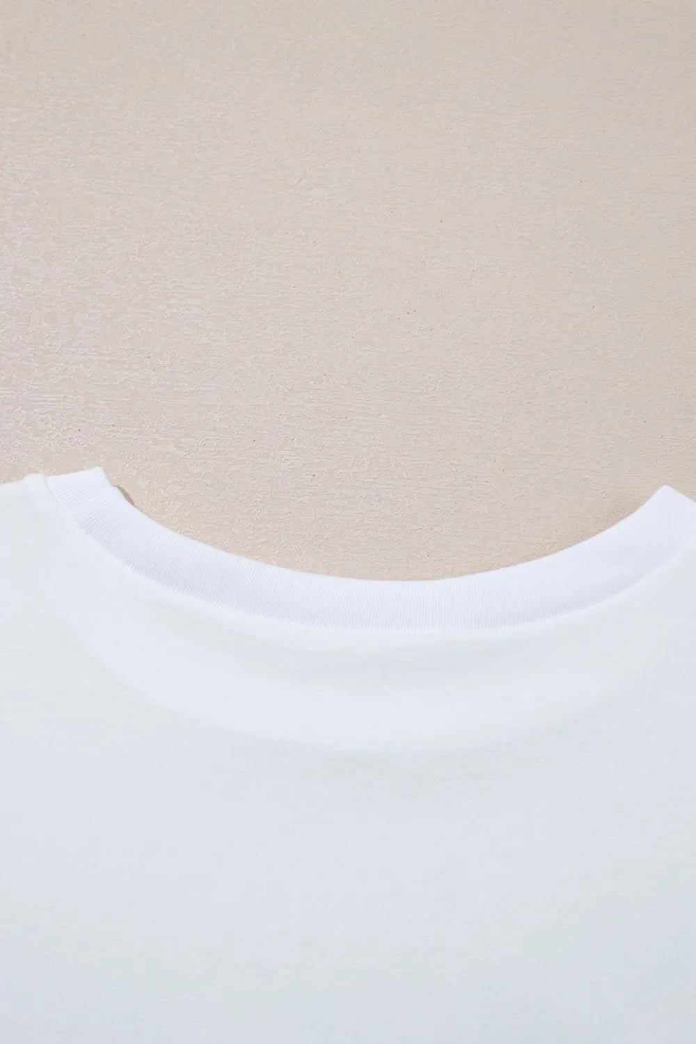 Camiseta holgada de media manga con dobladillo alto y bajo