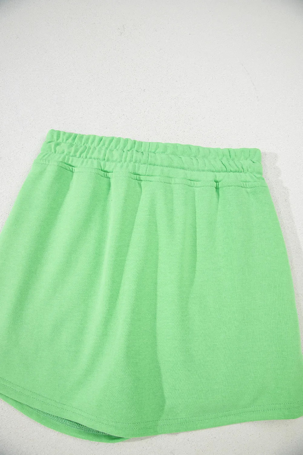 Minifalda pantalón lisa con cordón
